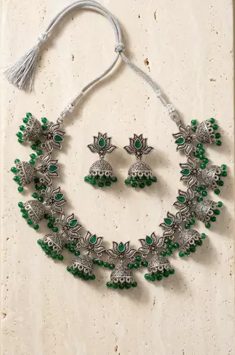Oxidized silver-tone lotus motif jhumki necklace set with emerald-green accents