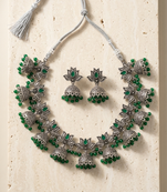 Oxidized silver-tone lotus motif jhumki necklace set with emerald-green accents
