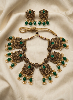 Gold plated-tone lotus motif jhumki necklace set with emerald-green accents 1