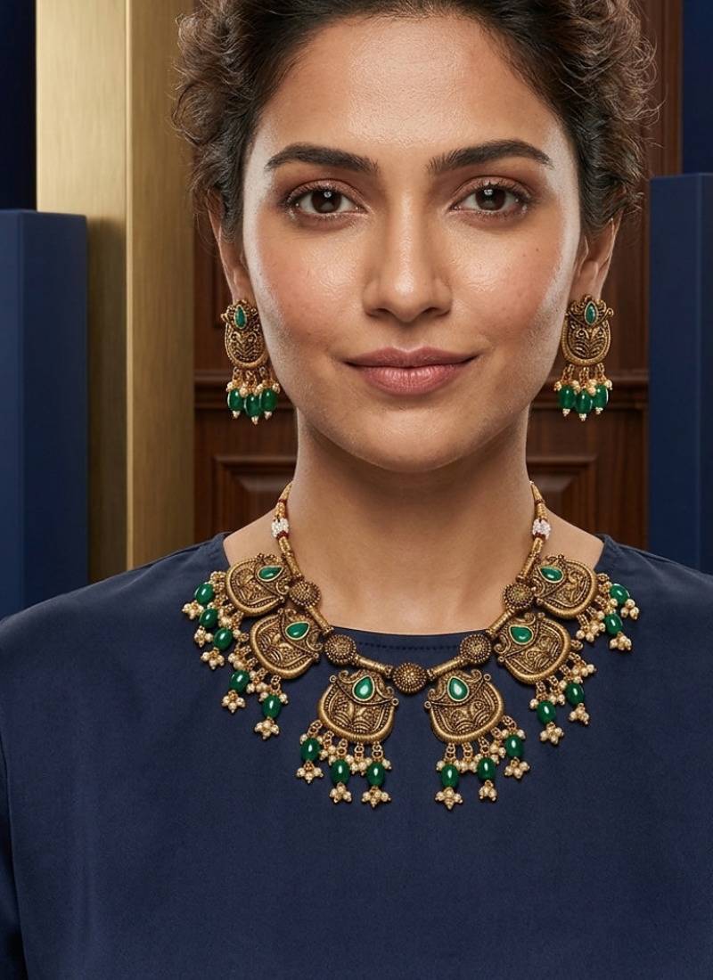 Gold plated-tone lotus motif jhumki necklace set with emerald-green accents