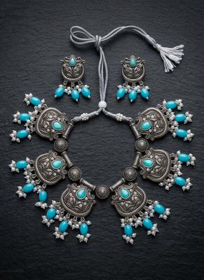 Oxidized silver-tone lotus motif jhumki necklace set with sapphire-blue accents 1