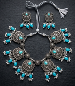 Oxidized silver-tone lotus motif jhumki necklace set with sapphire-blue accents