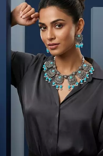 Oxidized silver-tone lotus motif jhumki necklace set with sapphire-blue accents
