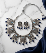 Oxidized silver-tone lotus motif jhumki necklace set with blue accents