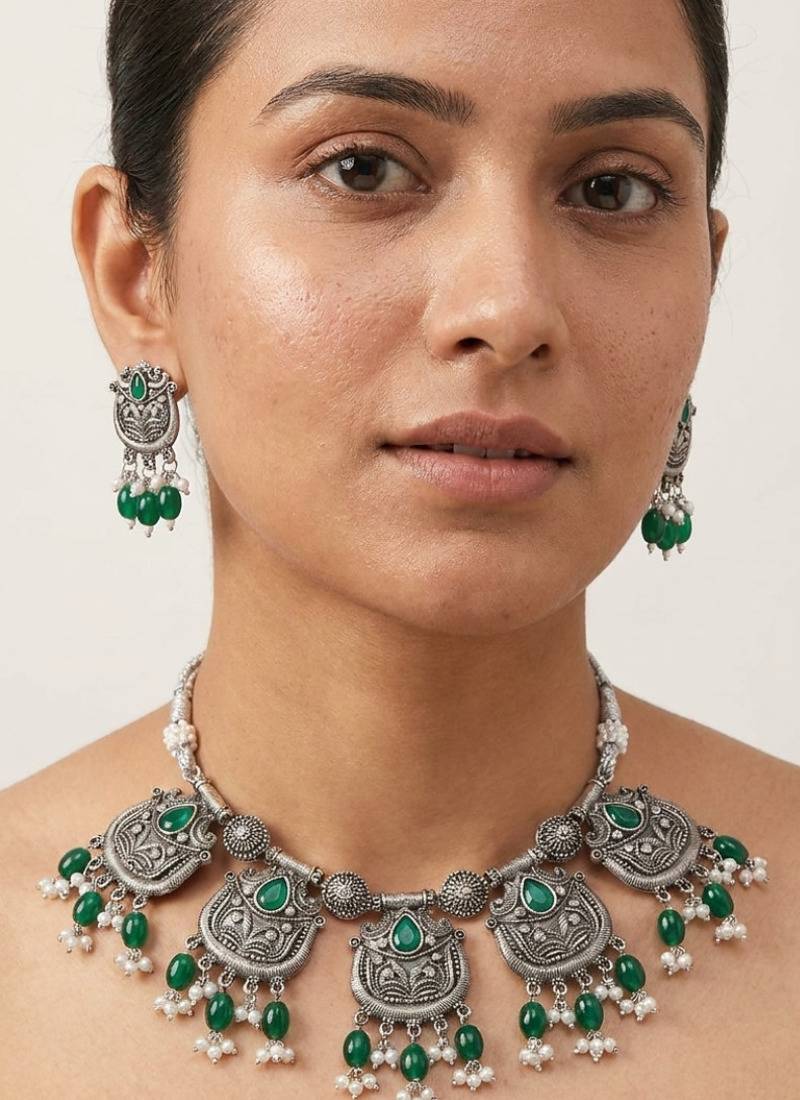 Oxidized silver-tone lotus motif jhumki necklace set with emerald-green accents