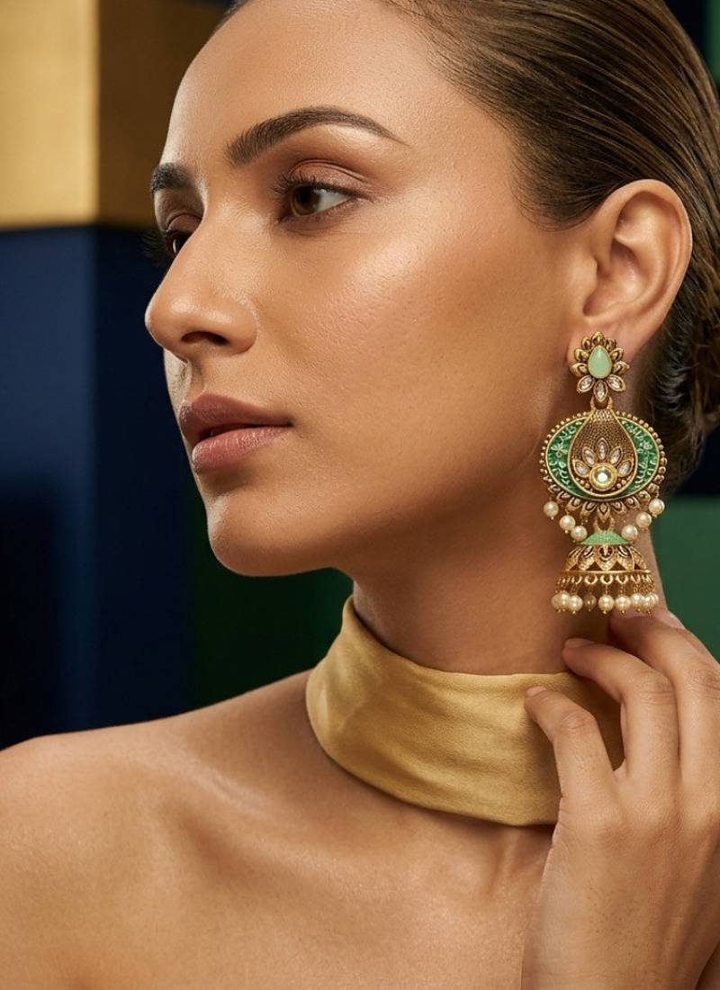 Traditional mint green meenakari & kundan antique gold-tone jhumka earrings with pearl drops