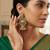 Traditional mint green meenakari & kundan antique gold-tone jhumka earrings with pearl drops