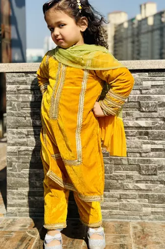 Mustard yellow embroidered velvet kurti set