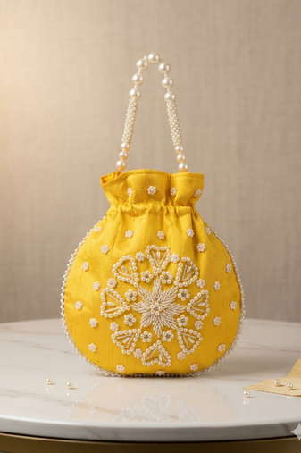 yellow pearl embroidered potli bag 