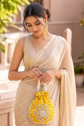yellow pearl embroidered potli bag 