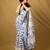 white printed georgette saree with unstitched blouse