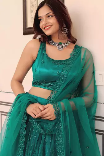 teal blue net embroidered lehenga choli with dupatta