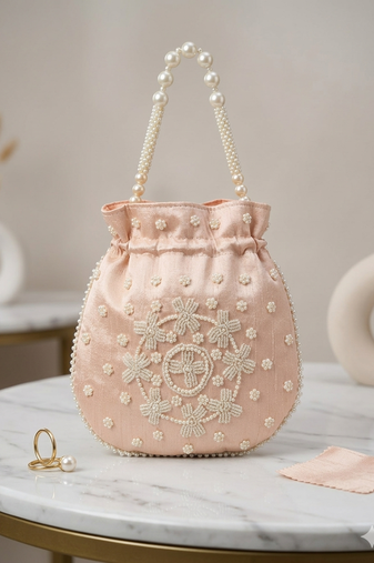 pastel peach pearl embroidered potli bag 