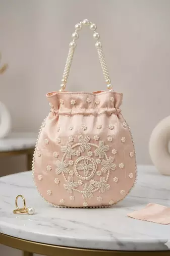 pastel peach pearl embroidered potli bag 