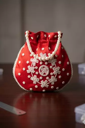 red peach pearl embroidered potli bag 
