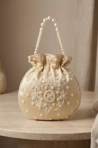 cream peach pearl embroidered potli bag 