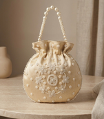 cream peach pearl embroidered potli bag 