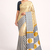 Cream printed satin saree with blouse piece