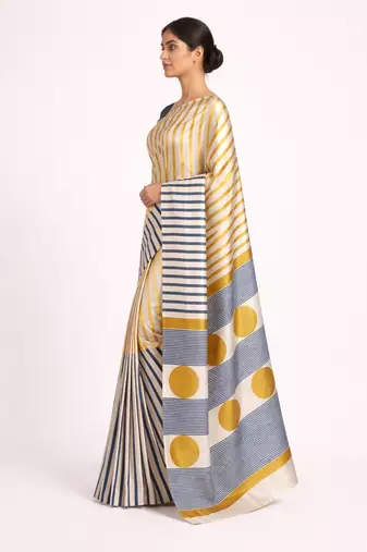 Cream printed satin saree with blouse piece