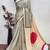 Beige printed satin saree with blouse piece