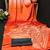 Orange printed satin saree with blouse piece
