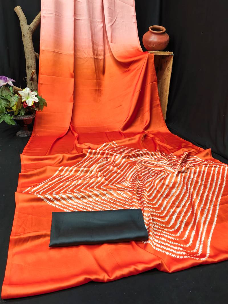 Orange printed satin saree with blouse piece