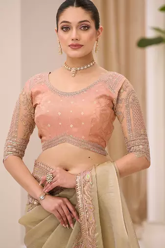 pista green faux tissue embroidered saree