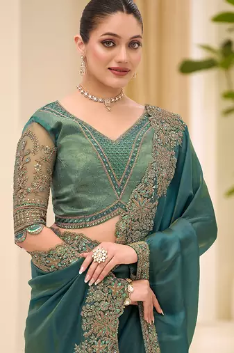 teal green faux tissue embroidered saree