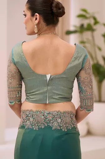teal green faux tissue embroidered saree