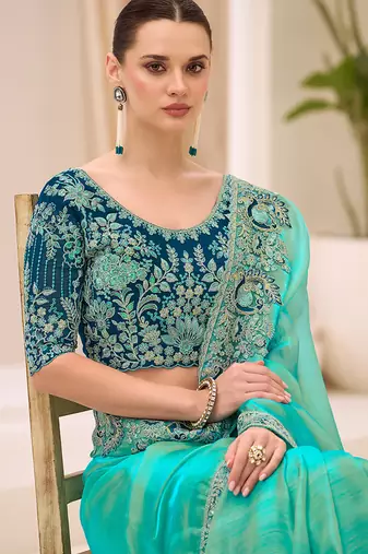 turquoise blue faux georgette embroidered saree