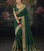 green embroidered green silk blend saree