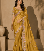 yellow embroidery sequin and multi border silk saree