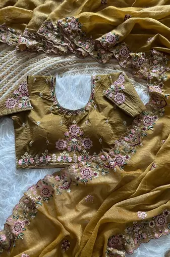 yellow embroidery sequin and multi border silk saree