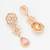 festive rose gold pink floral bib necklace set with stone drops and flower cluster earrings