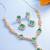 party wear rose gold emerald green stone y-drop necklace set with marquise drop earrings