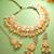 party wear peach kundan choker necklace set with pearls and maang tikka