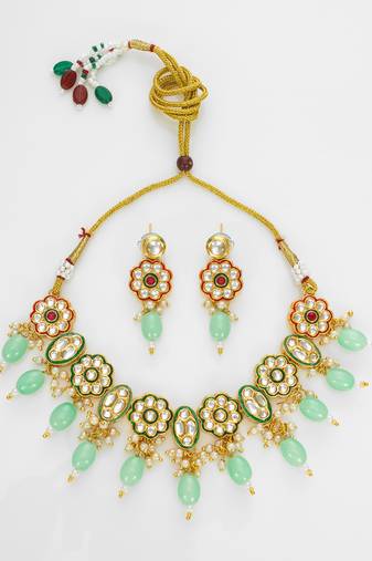 gold plated mint green kundan set