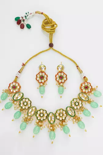 gold plated mint green kundan set
