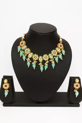 gold plated mint green kundan set
