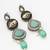 oxidized silver catseye necklace set with panther motif panels and pearl drop earrings