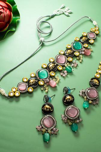 oxidized silver elephant motif choker necklace set with catseye stones, earrings and maang tikka