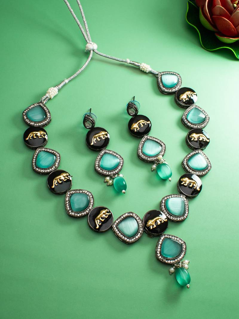 oxidized silver catseye necklace set with panther motif panels and pearl drop earrings