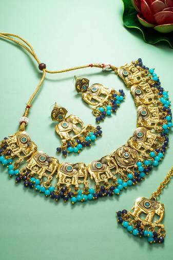 antique gold elephant motif choker necklace set with beads, earrings and maang tikka