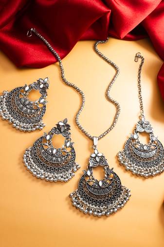 oxidized silver chandbali mirror work pendant necklace set with earrings and maang tikka