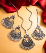 oxidized silver chandbali mirror work pendant necklace set with earrings and maang tikka
