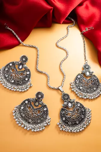 oxidized silver floral chandbali pendant necklace set with mirror work earrings and maang tikka