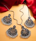 oxidized silver floral chandbali pendant necklace set with mirror work earrings and maang tikka