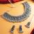 oxidized silver floral shield choker necklace set with ghungroo earrings and maang tikka