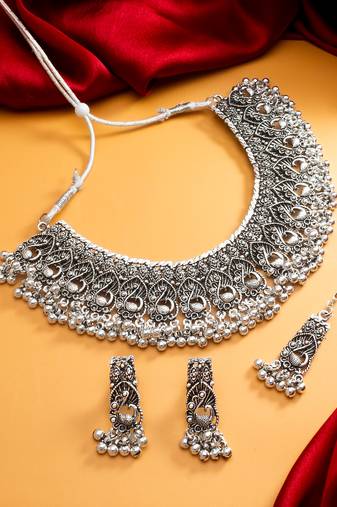 oxidized silver peacock motif choker necklace set with ghungroo earrings and maang tikka