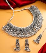 oxidized silver peacock motif choker necklace set with ghungroo earrings and maang tikka